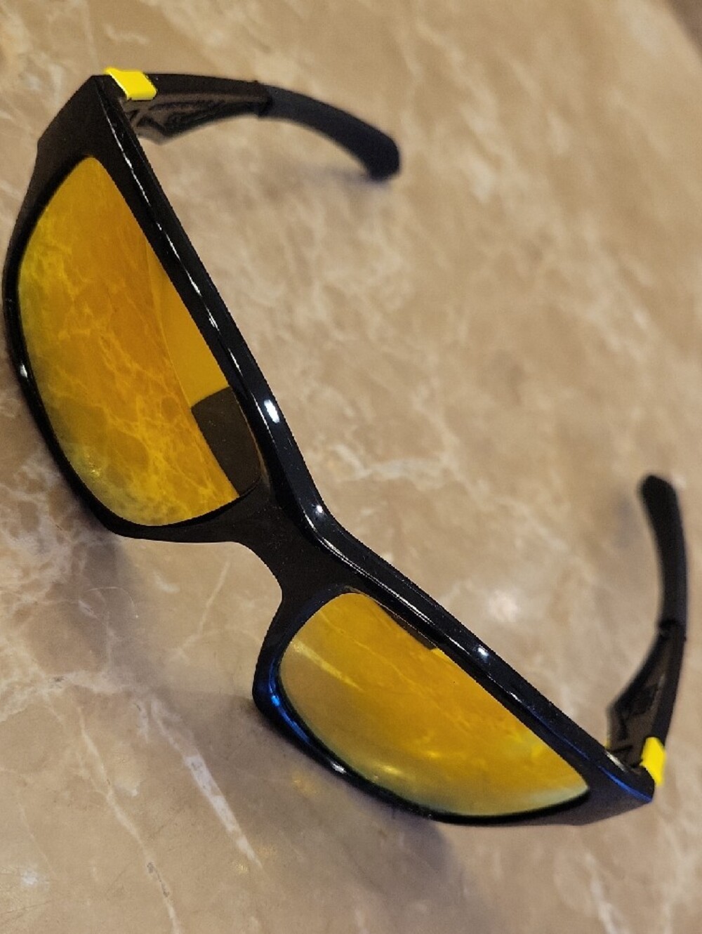 Oakley Black Jupiter Frame Sunglasses with Yellow Mirrored Lenses